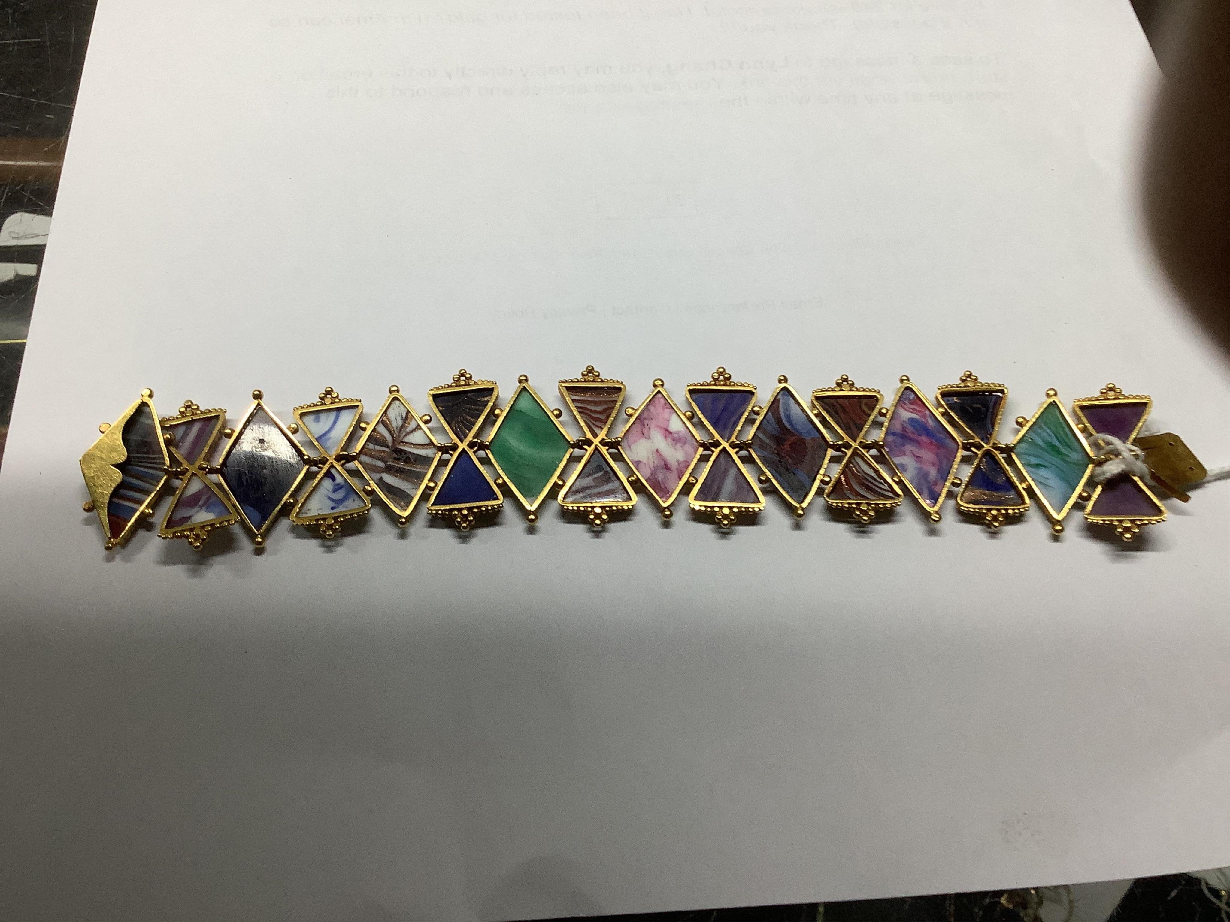 A mid 20th century gold and multi coloured Murano glass set bracelet